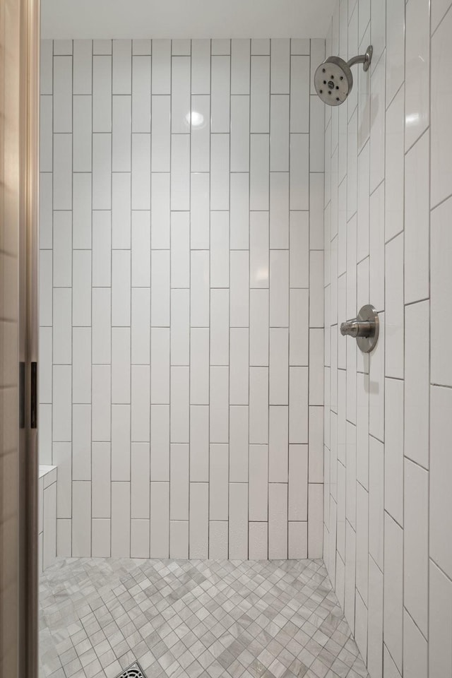 bathroom with a tile shower