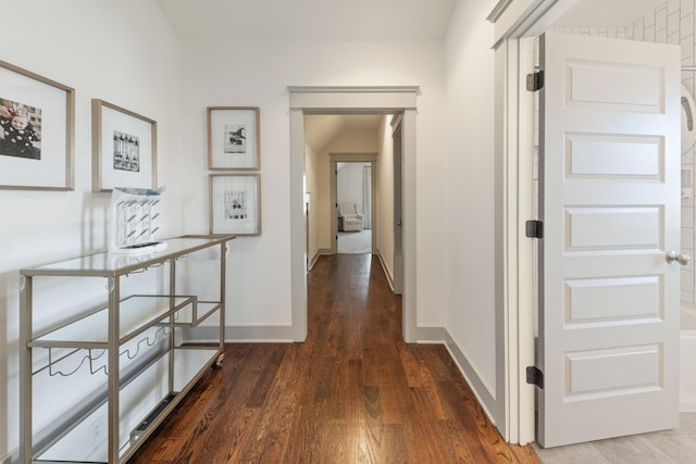 hall with dark hardwood / wood-style flooring