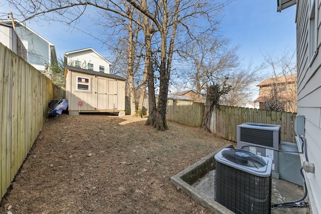 view of yard featuring central air condition unit and a shed