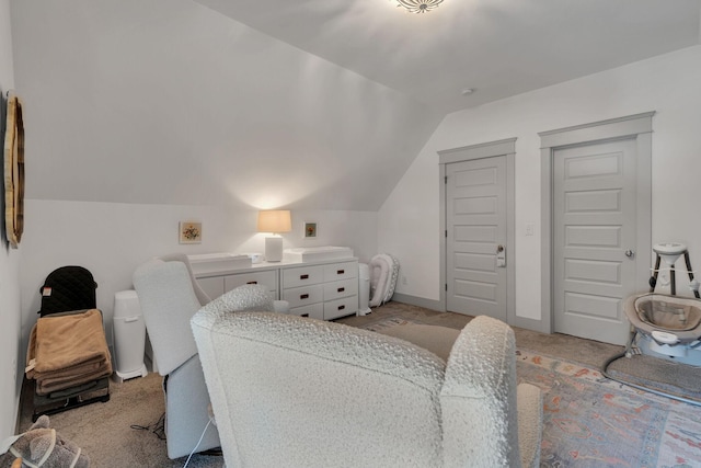 bedroom featuring light carpet and lofted ceiling