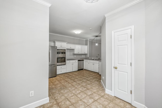 kitchen with white cabinets, crown molding, appliances with stainless steel finishes, and sink