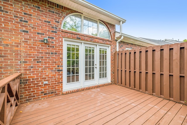 wooden deck featuring french doors