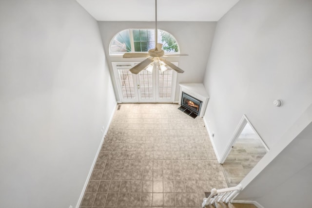 unfurnished living room featuring ceiling fan