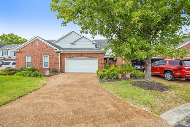 view of front of home featuring a garage and a front lawn