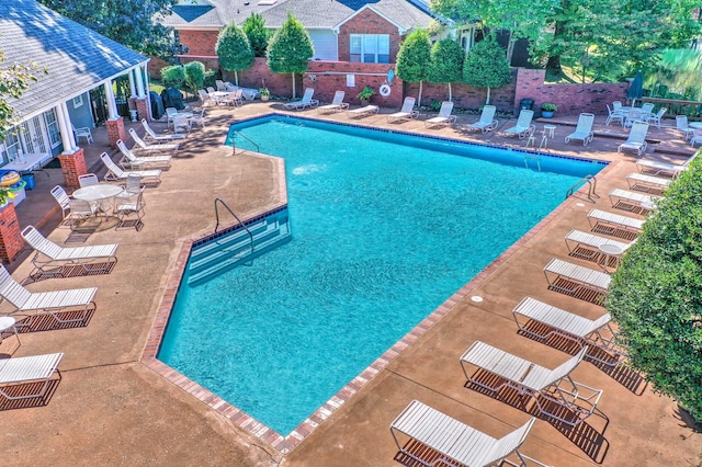 view of swimming pool featuring a patio