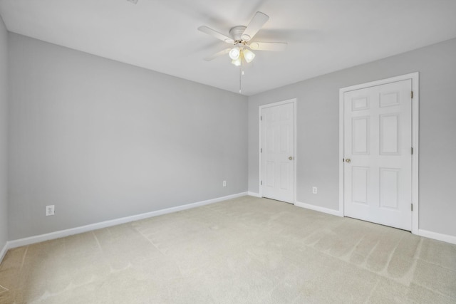 unfurnished bedroom with ceiling fan and carpet floors