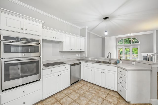 kitchen featuring sink, white cabinets, kitchen peninsula, and appliances with stainless steel finishes