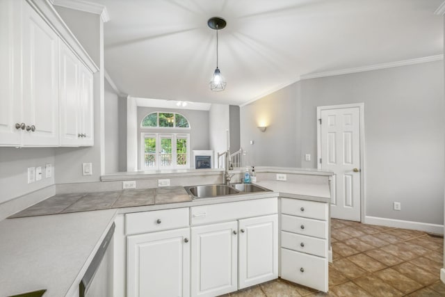 kitchen featuring sink, hanging light fixtures, white cabinets, and stainless steel dishwasher