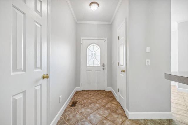 doorway featuring crown molding and light tile patterned floors