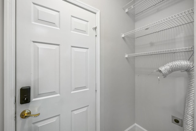 washroom with hookup for an electric dryer