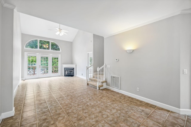 unfurnished living room with high vaulted ceiling, tile patterned floors, ceiling fan, and ornamental molding