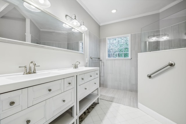 bathroom featuring ornamental molding, tiled shower, tile patterned flooring, and vanity