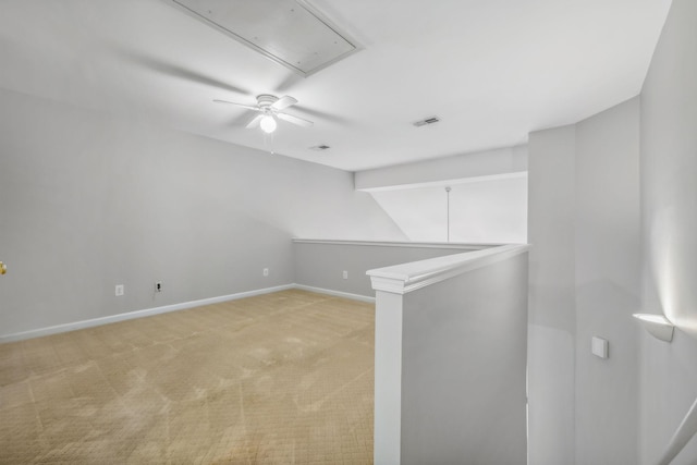 unfurnished room with light colored carpet