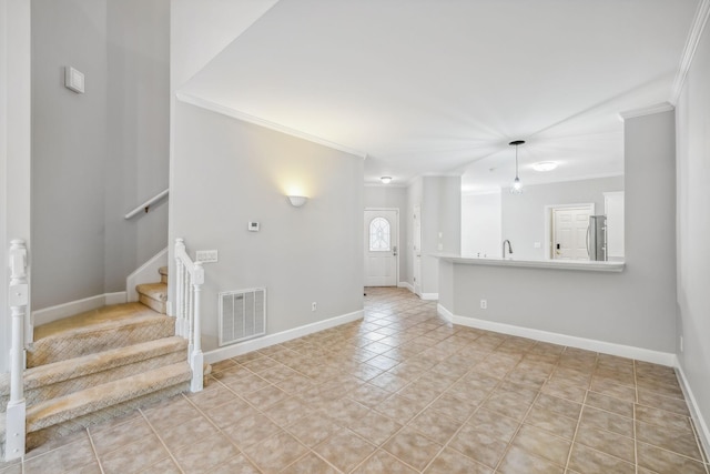 unfurnished living room featuring crown molding and light tile patterned flooring