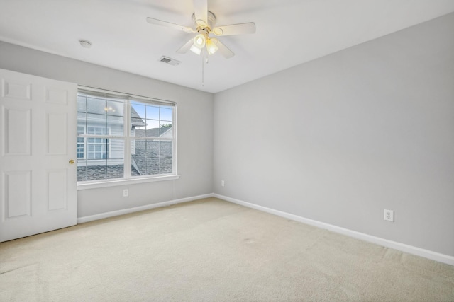 carpeted empty room with ceiling fan