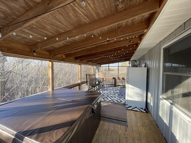 deck featuring a hot tub