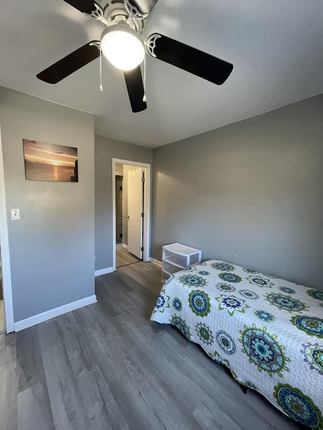 bedroom featuring hardwood / wood-style floors and ceiling fan