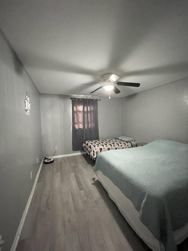 bedroom featuring hardwood / wood-style floors and ceiling fan