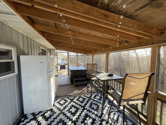 sunroom with beam ceiling