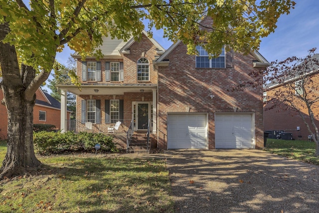 view of front of house with a porch and a garage