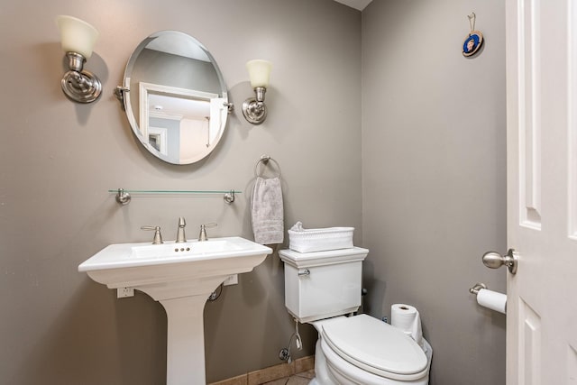 bathroom featuring sink and toilet