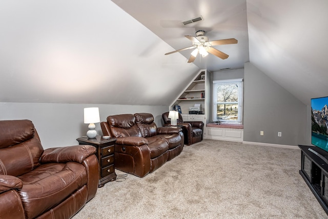 living room featuring vaulted ceiling, light colored carpet, built in features, and ceiling fan