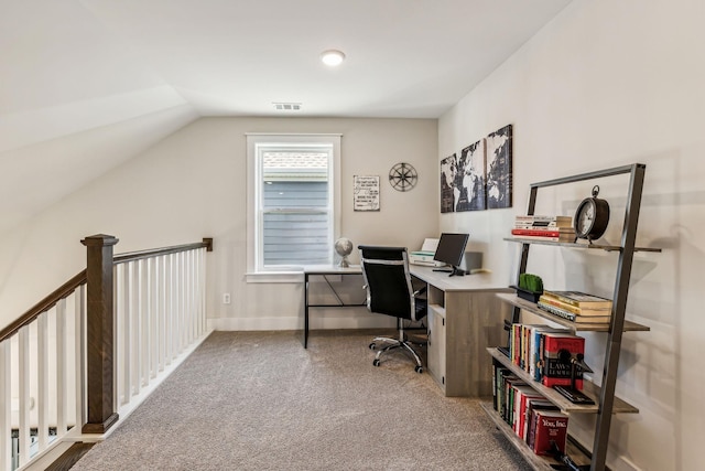 home office with carpet flooring and vaulted ceiling