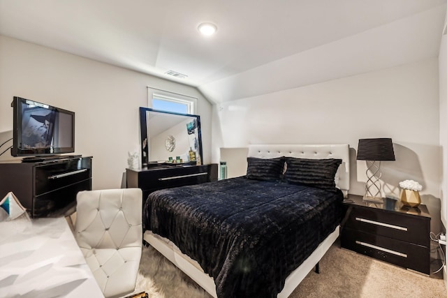 carpeted bedroom featuring vaulted ceiling