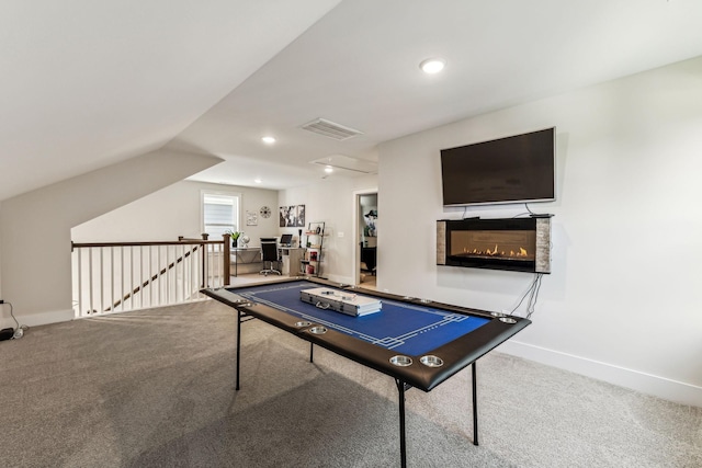 recreation room with carpet floors and lofted ceiling