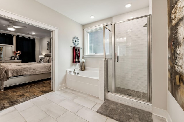 bathroom with tile patterned flooring, ceiling fan, and shower with separate bathtub