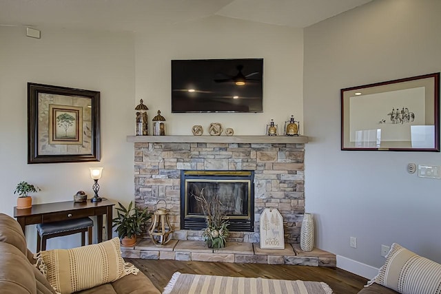 living room with lofted ceiling, wood-type flooring, and a fireplace