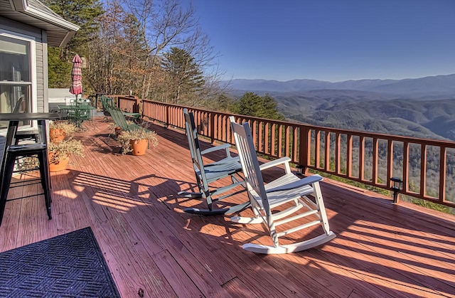 wooden terrace featuring a mountain view