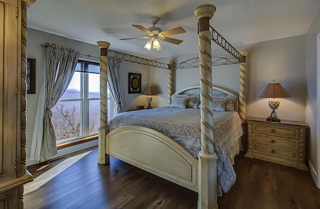 bedroom with dark wood-type flooring and ceiling fan