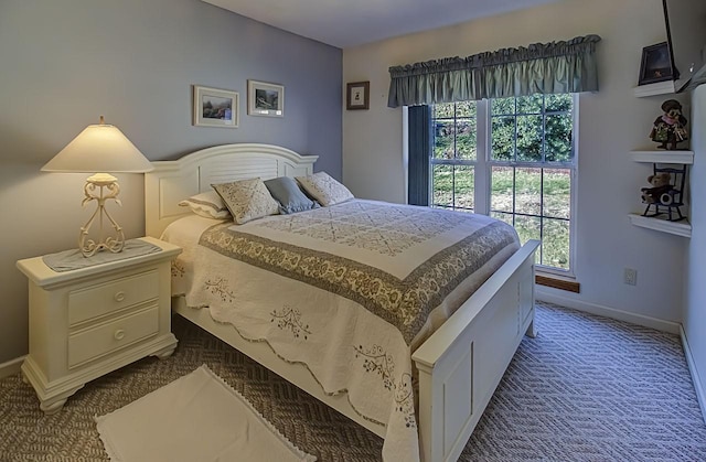 carpeted bedroom featuring multiple windows