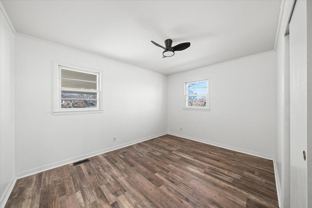 unfurnished room with dark hardwood / wood-style floors, ceiling fan, and ornamental molding