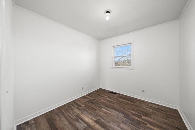 unfurnished room with ornamental molding and dark hardwood / wood-style flooring