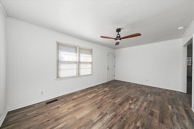 unfurnished room featuring ornamental molding, ceiling fan, and dark hardwood / wood-style flooring