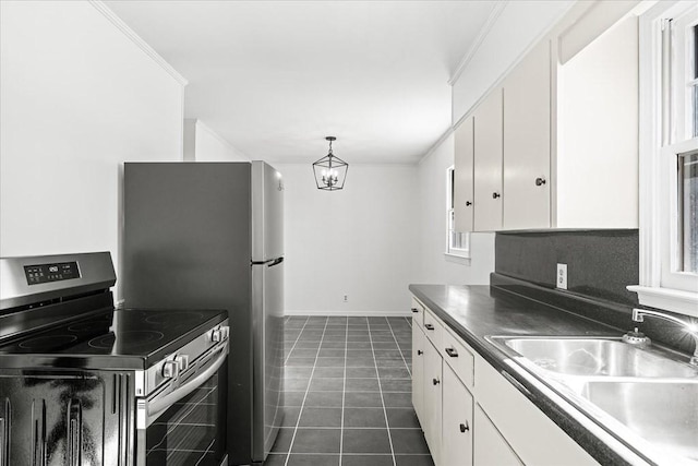 kitchen featuring pendant lighting, sink, white cabinetry, stainless steel range with electric stovetop, and dark tile patterned flooring