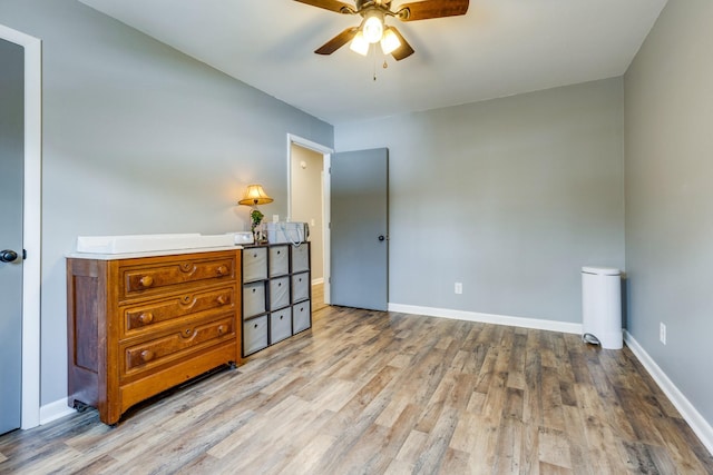 bedroom with ceiling fan and light hardwood / wood-style flooring