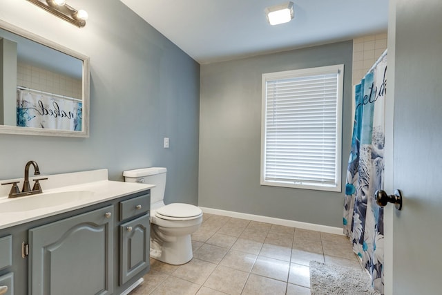 bathroom featuring curtained shower, toilet, tile patterned floors, and vanity