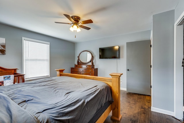 bedroom featuring ceiling fan and dark hardwood / wood-style floors