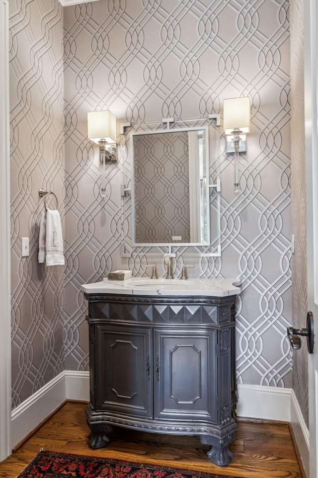 bathroom with hardwood / wood-style flooring and vanity