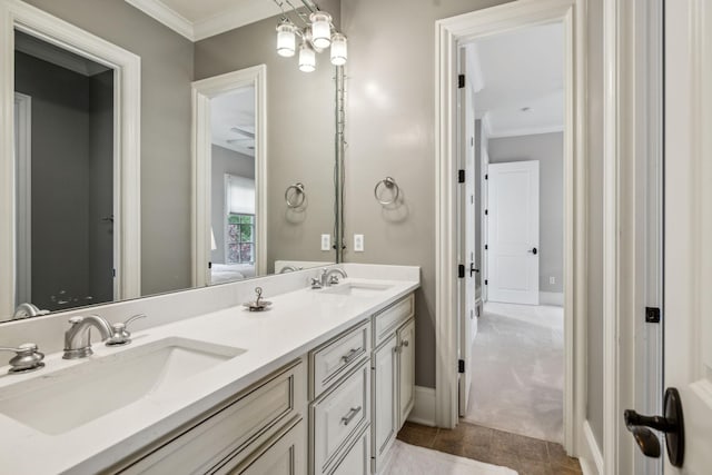 bathroom featuring vanity, crown molding, and tile patterned flooring