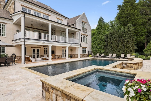 view of pool featuring an in ground hot tub, a patio area, ceiling fan, and french doors