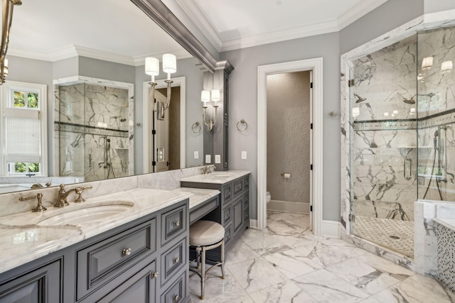 bathroom with a shower with shower door, vanity, and ornamental molding