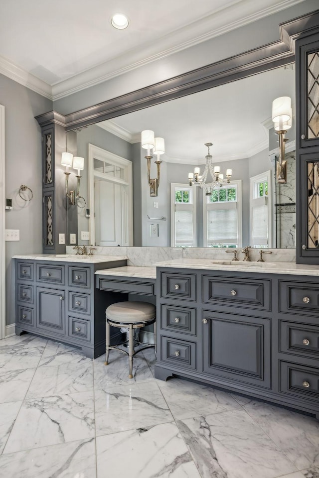 bathroom featuring vanity, crown molding, and an inviting chandelier