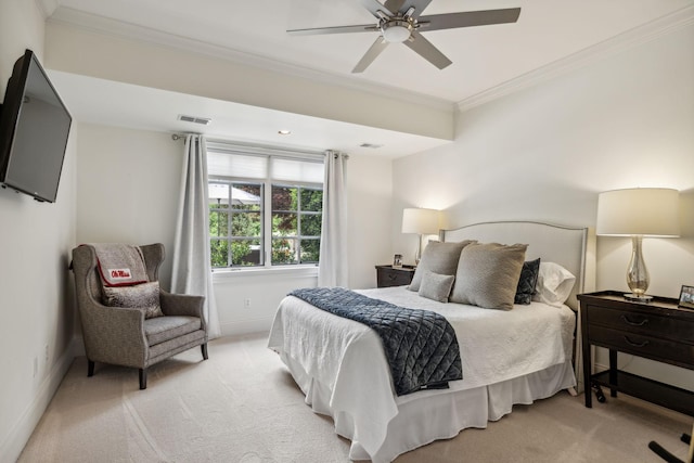 bedroom featuring ceiling fan, light colored carpet, and crown molding