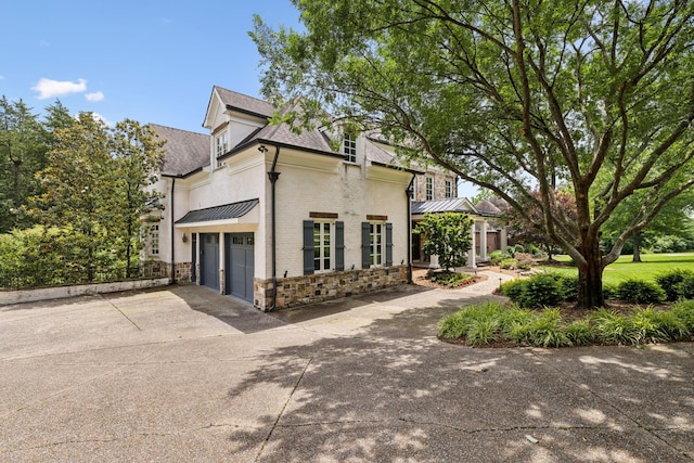 view of side of property with a garage