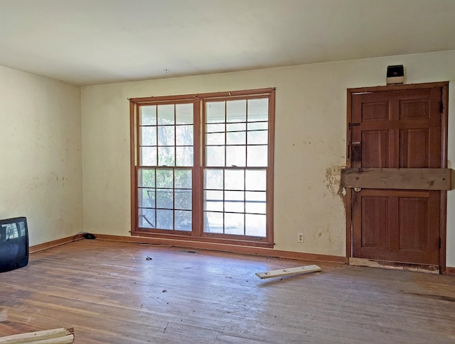 spare room featuring light wood-type flooring