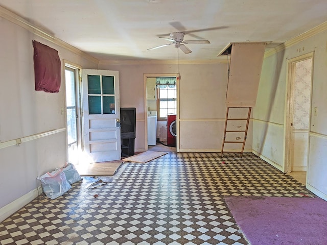miscellaneous room with ceiling fan, crown molding, and washer / clothes dryer